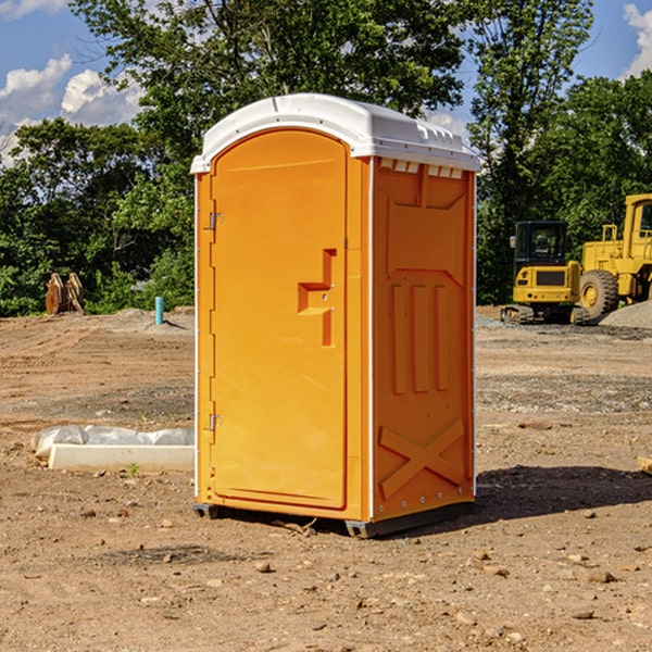 what is the cost difference between standard and deluxe portable restroom rentals in Dunnegan